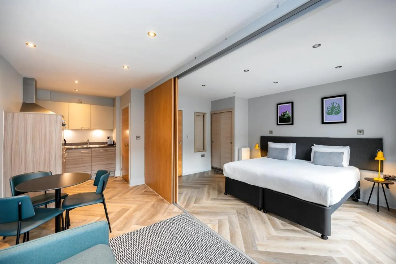 a hotel room with a bed and a kitchen at Staycity Aparthotels Edinburgh West End in Edinburgh