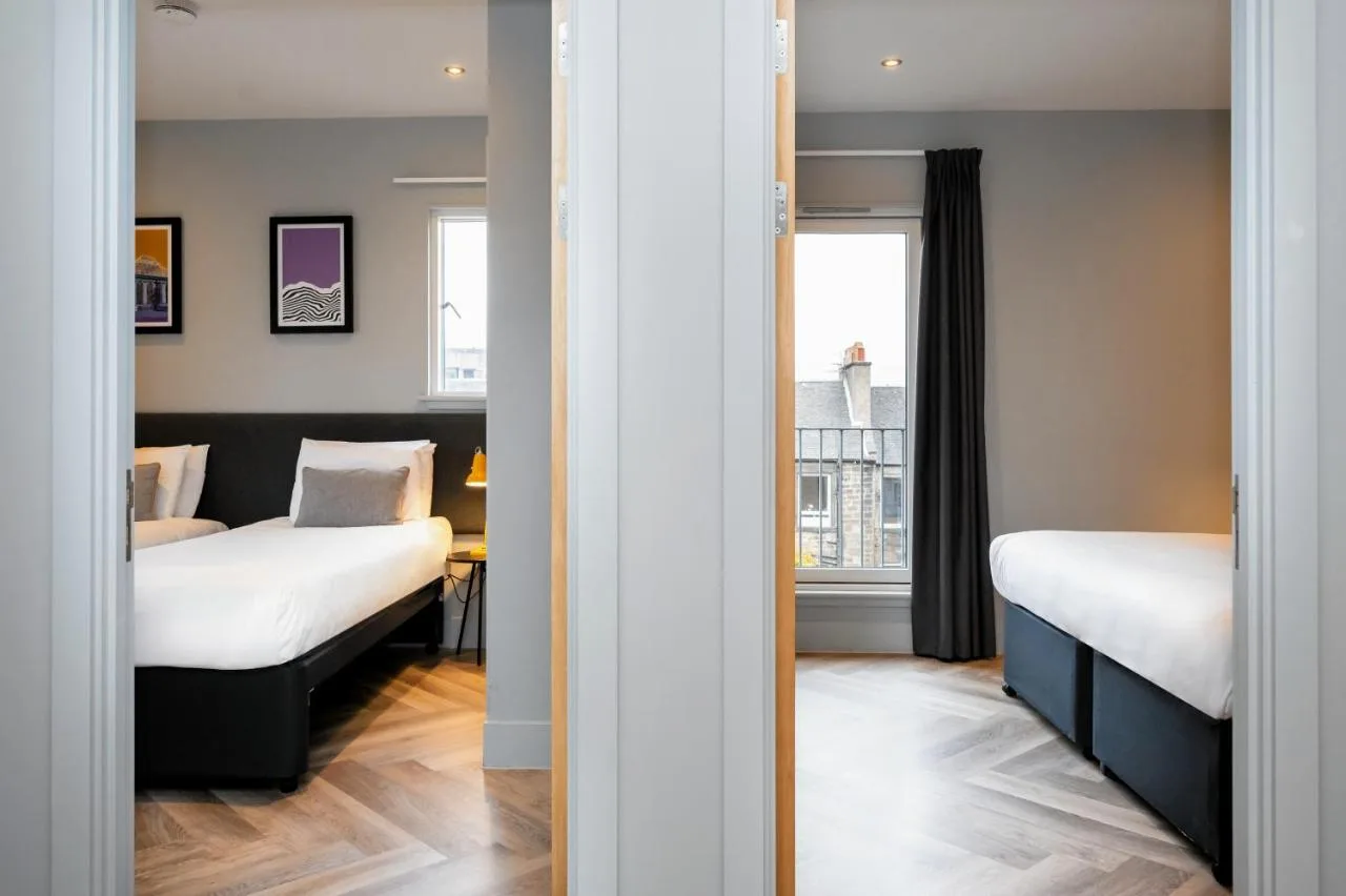 a bedroom with two beds and a window at Staycity Aparthotels Edinburgh West End in Edinburgh
